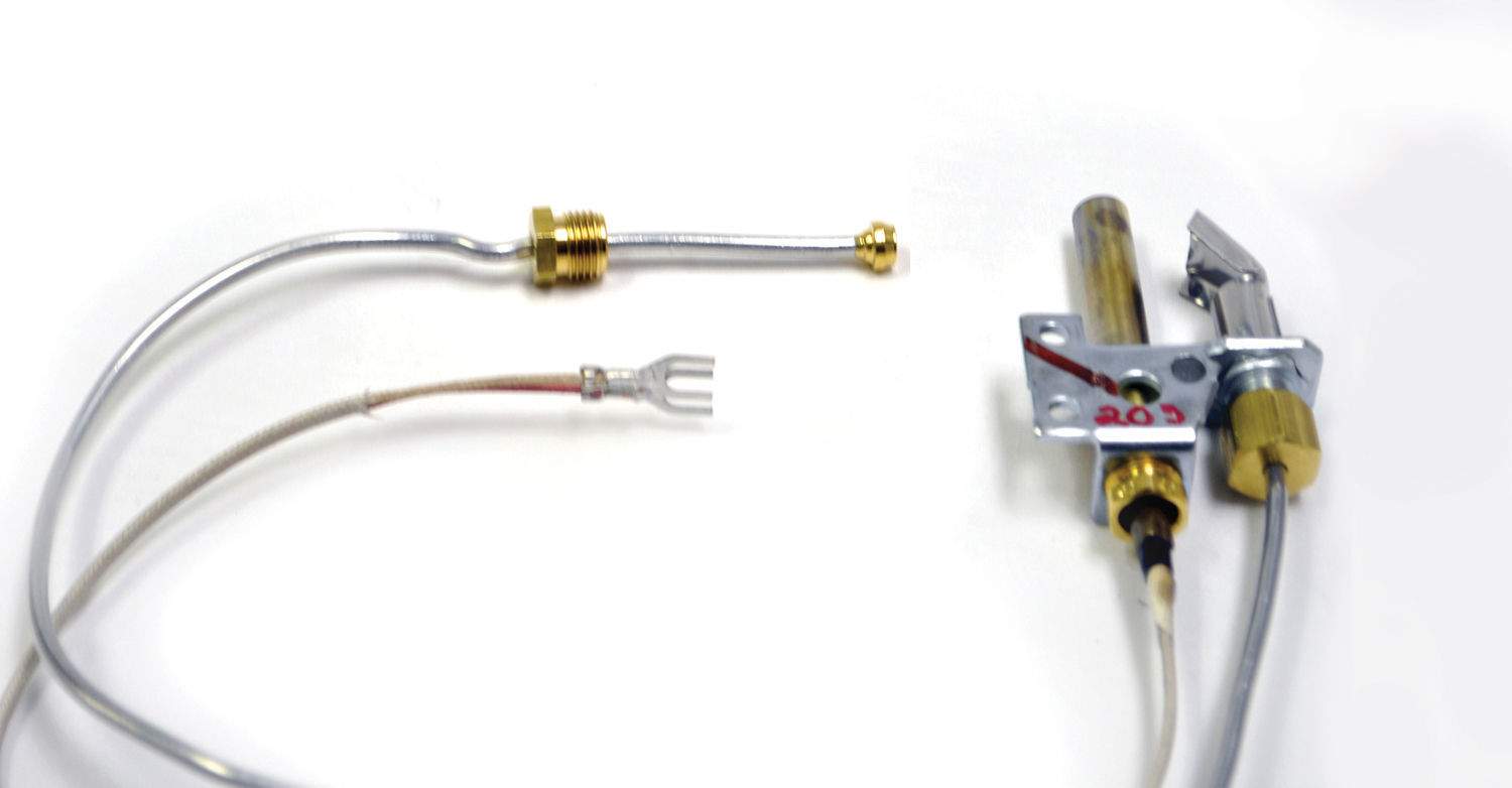 Millivolt pilot assembly with ignition bracket, brass fittings, and two cable leads