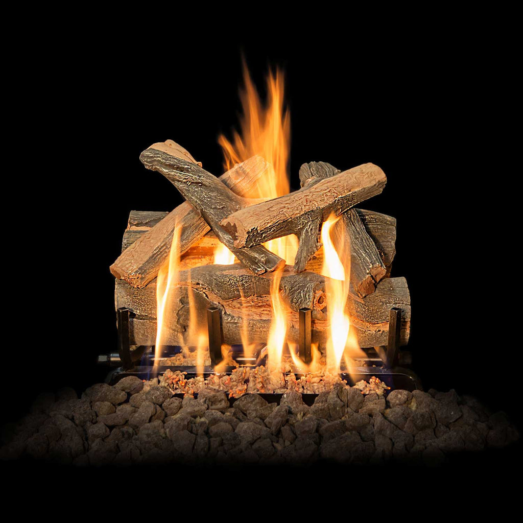 Vented gas log set with split log pieces and flames over a rock bed