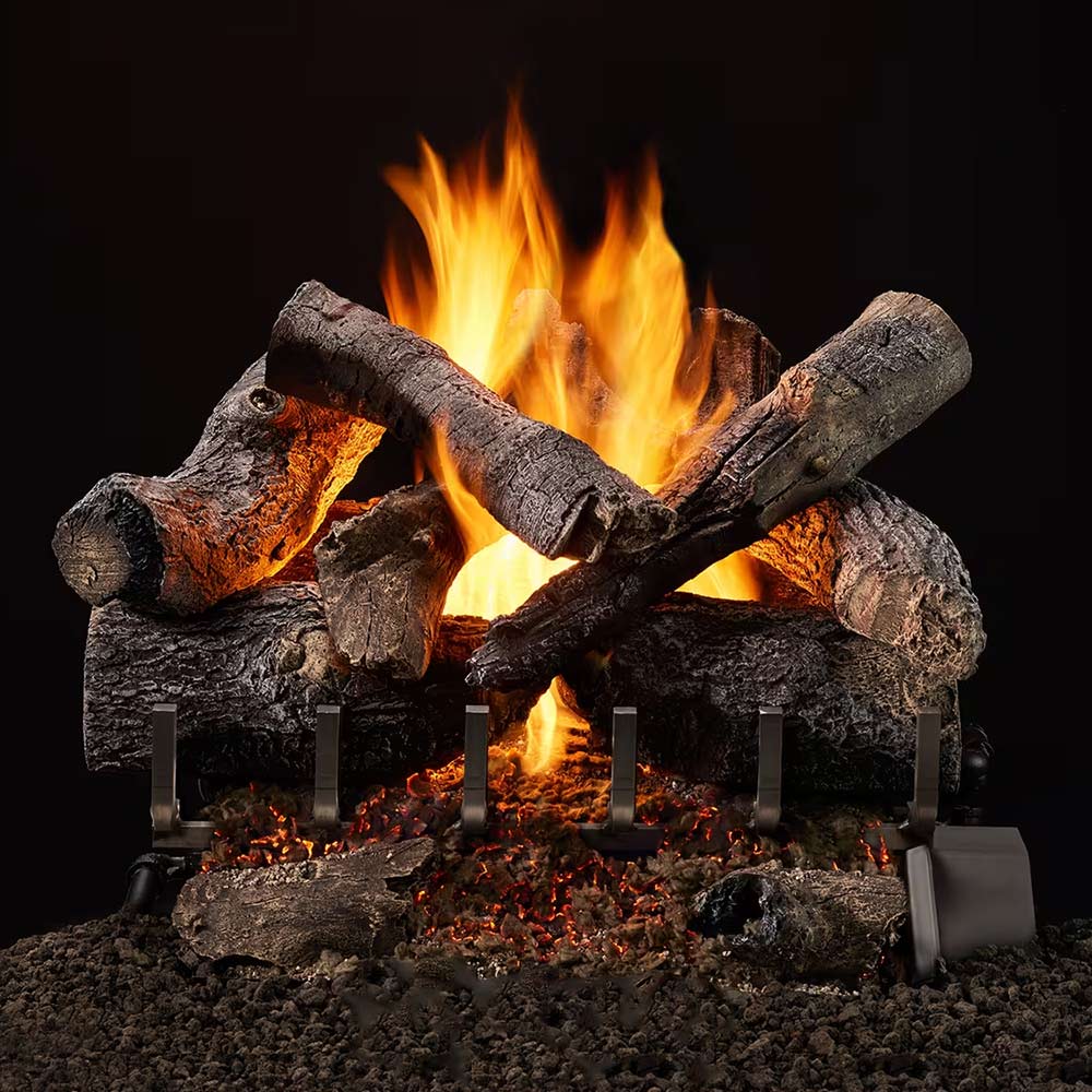 Outdoor vented gas log set with glowing logs, bright flames, and rock-ember base