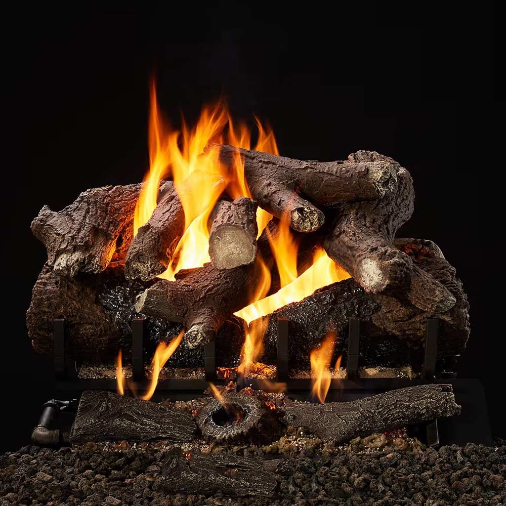 Indoor gas log set with dark logs and tall yellow-orange flames