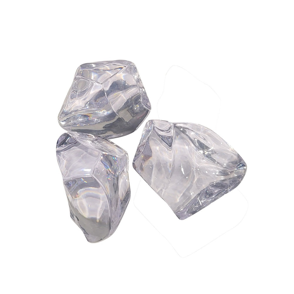 Three clear acrylic crystal cubes with faceted sides.