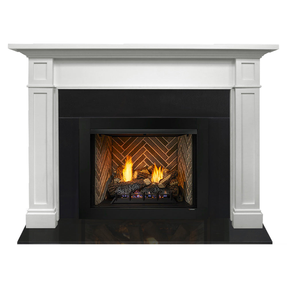 White mantel fireplace with black firebox and burning logs in a stone surround