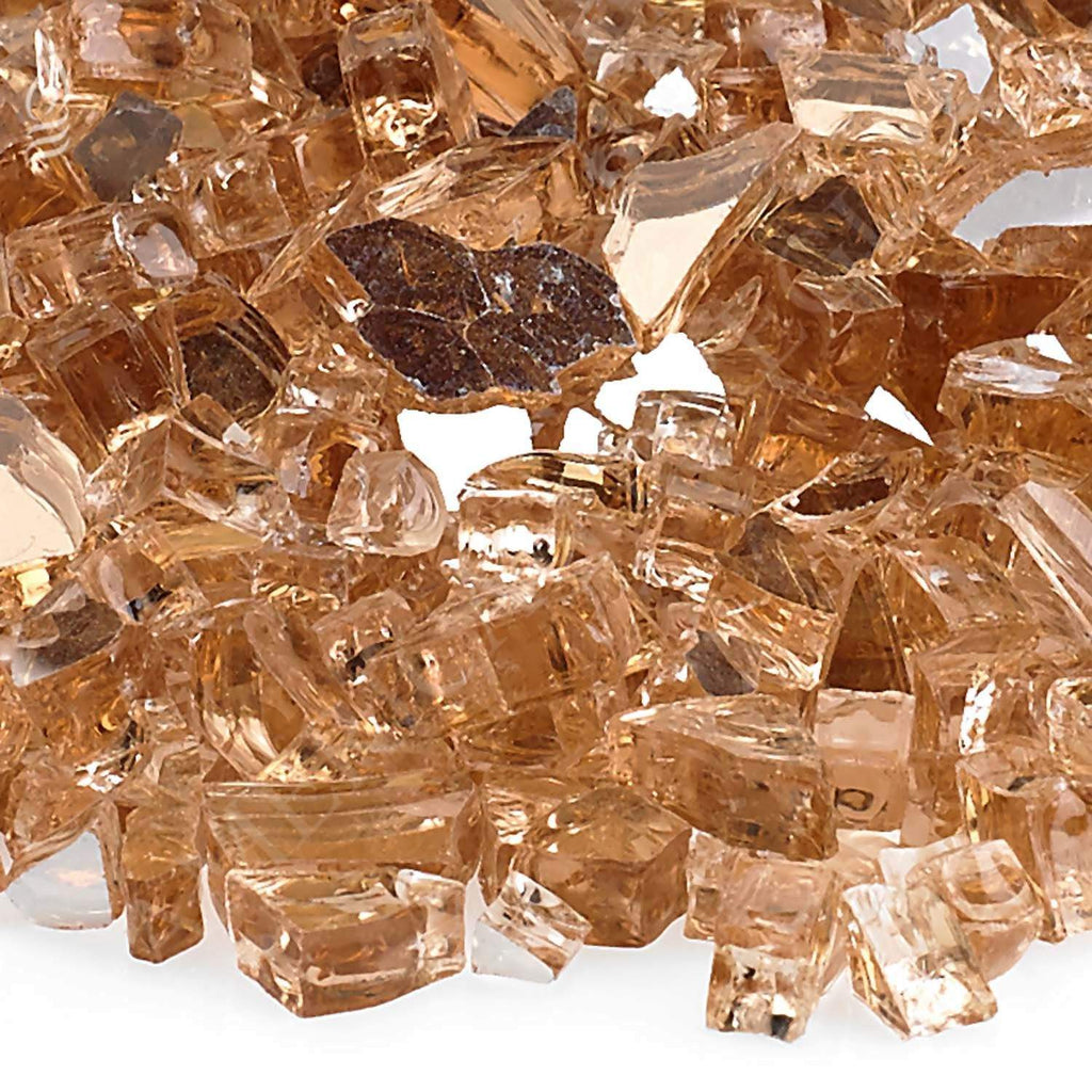 Close-up of champagne reflective fire glass shards with faceted surfaces