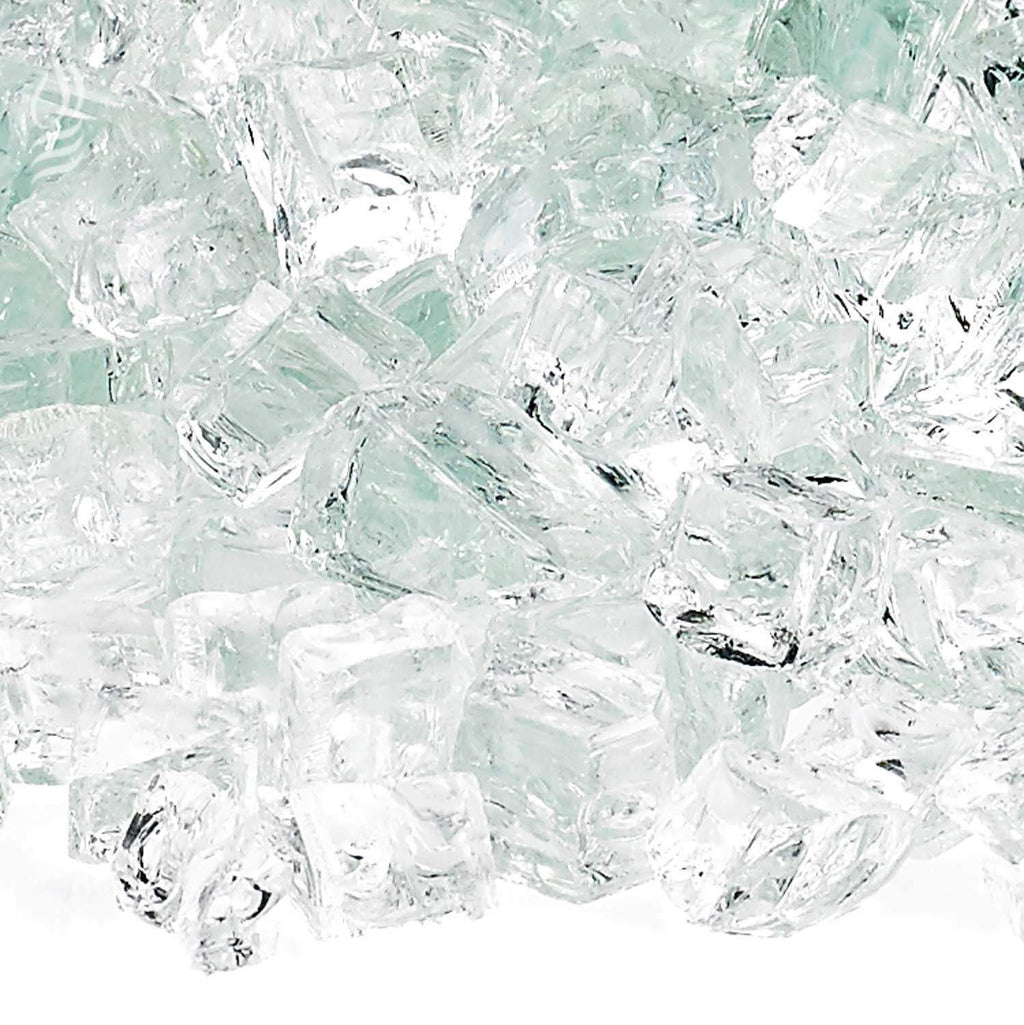 Close-up of clear fire glass shards with pale aqua tones