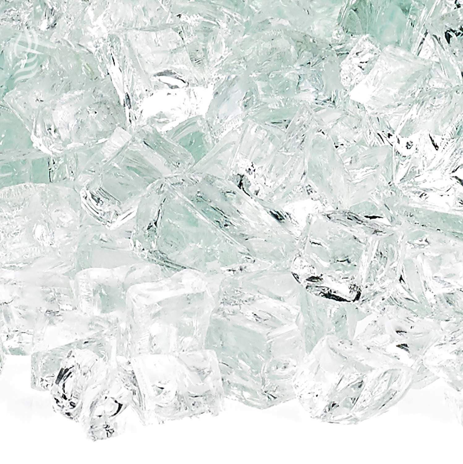 Close-up of clear fire glass shards with pale aqua tones