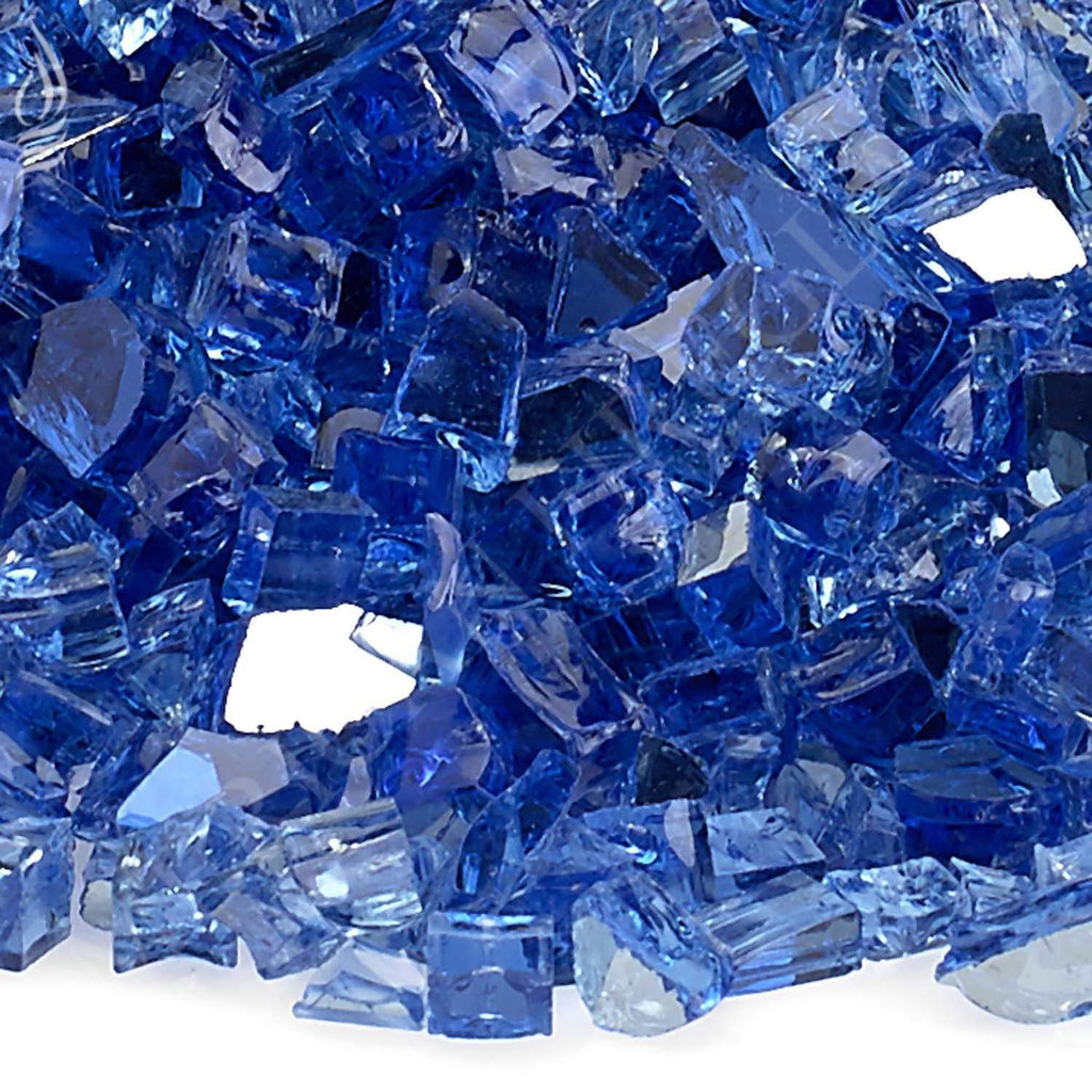 Close-up of cobalt blue reflective fire glass shards with faceted edges