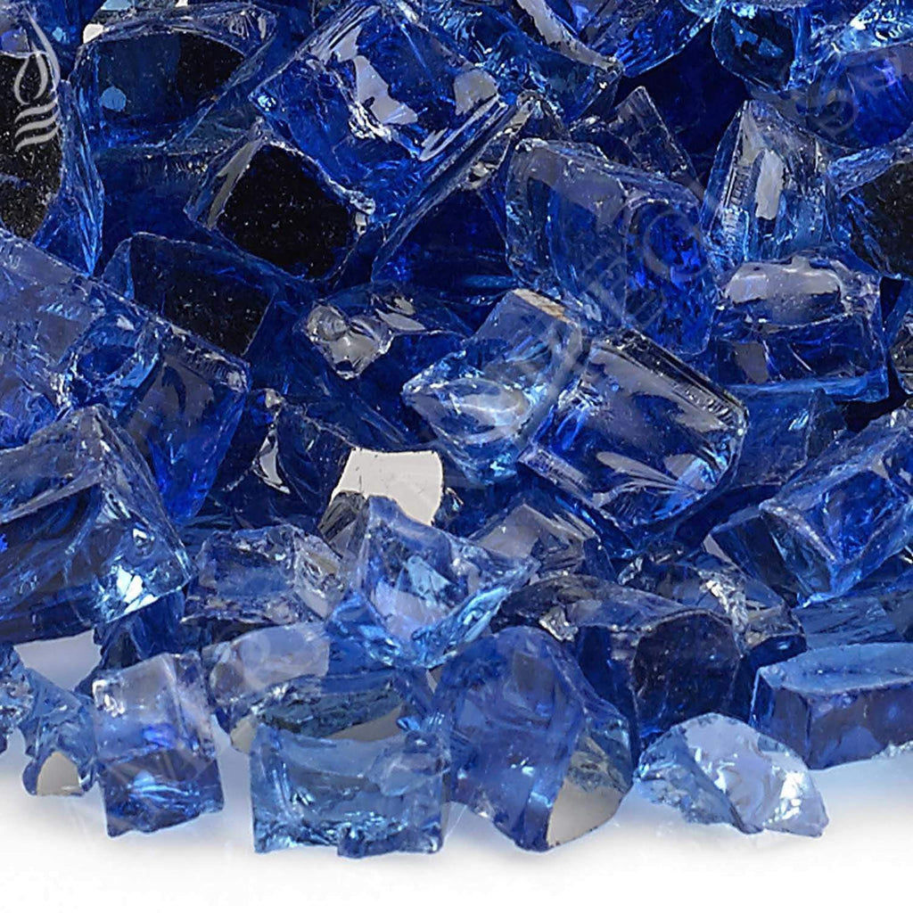 Close-up of cobalt blue reflective fire glass shards with faceted surfaces