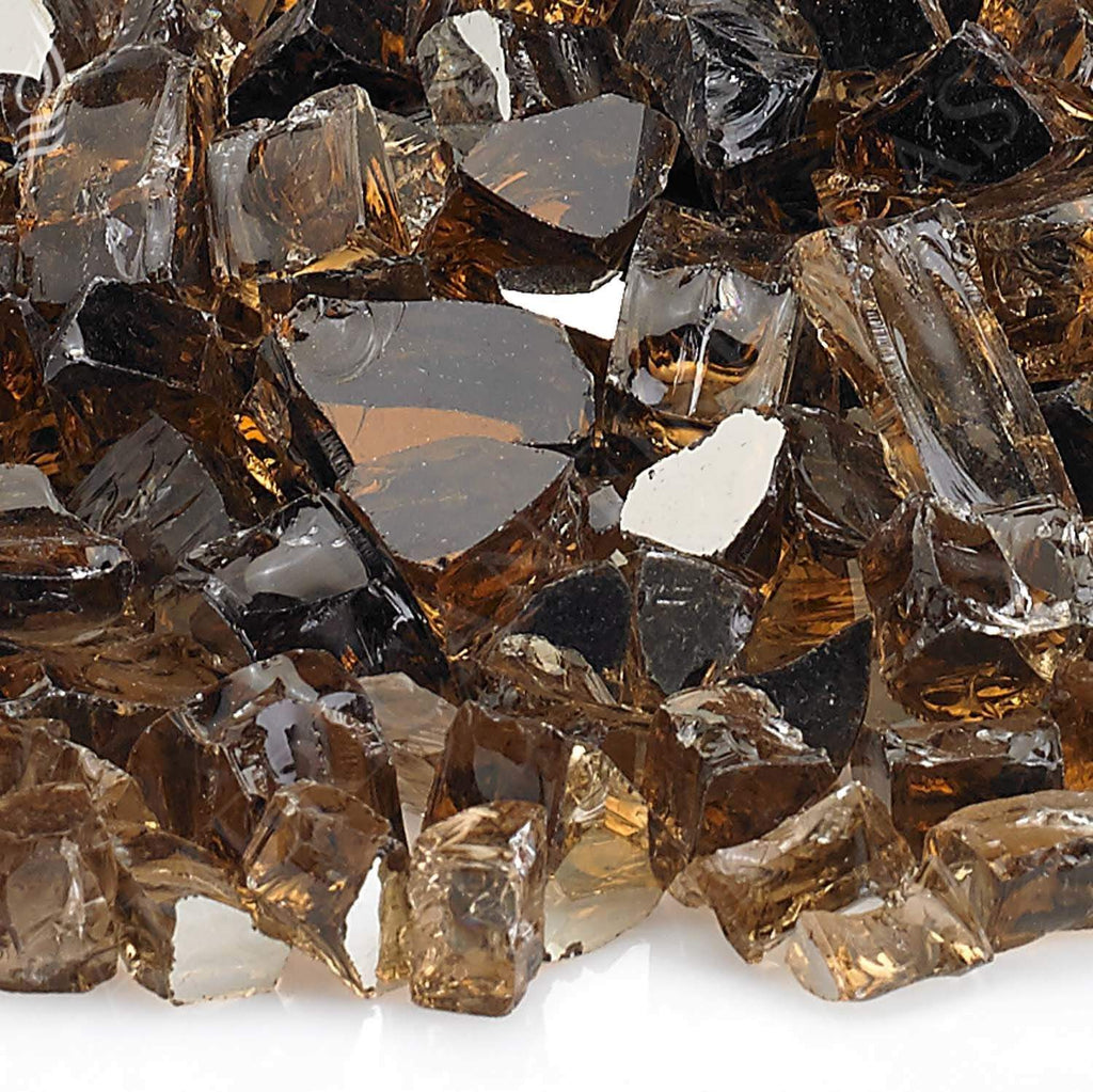 Copper reflective fire glass close-up with faceted dark brown, clear, and amber pieces