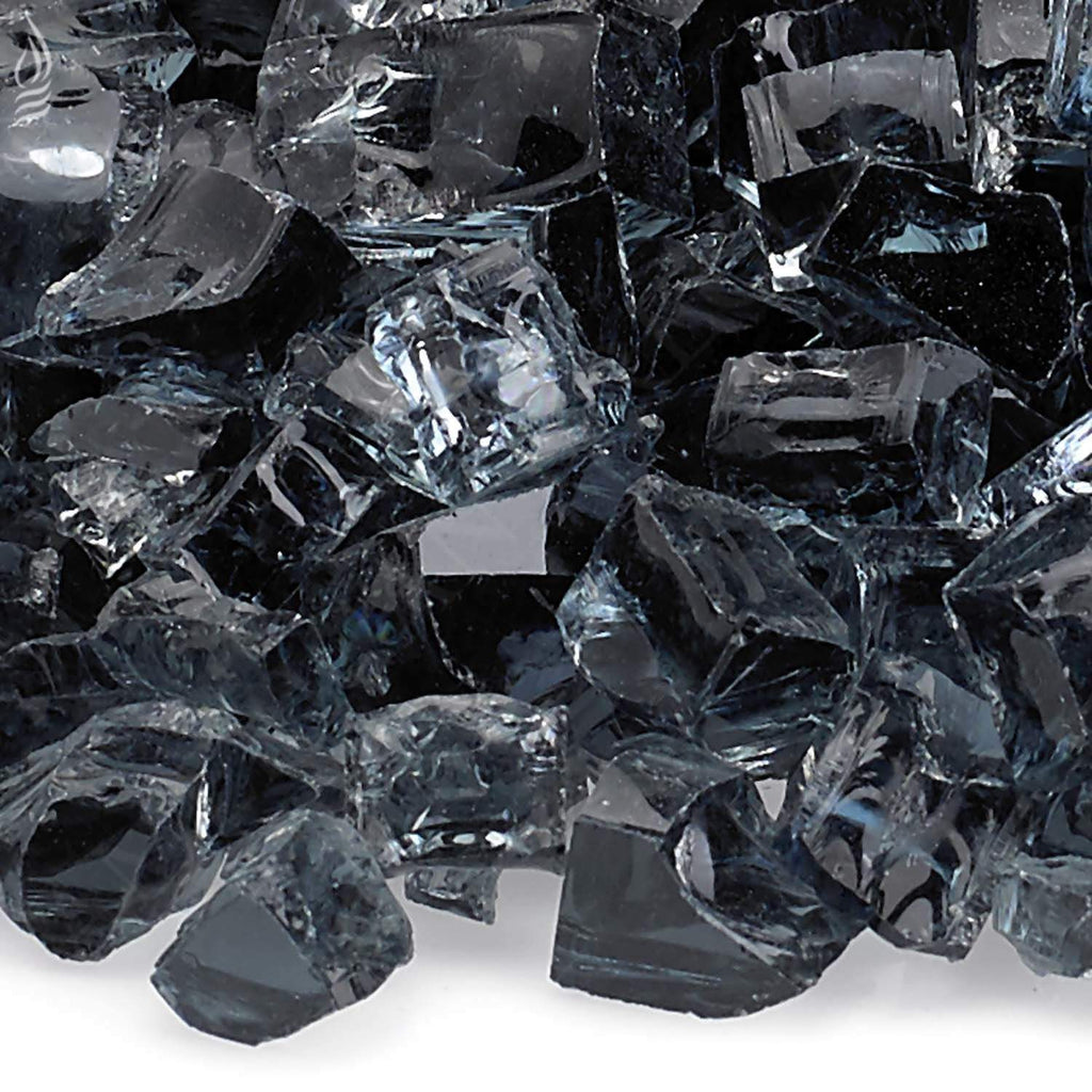 Close-up of dark grey fire glass shards with shiny, faceted edges