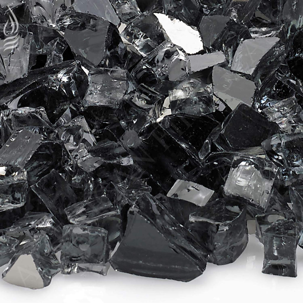 Close-up of grey reflective fire glass chunks with faceted sparkle