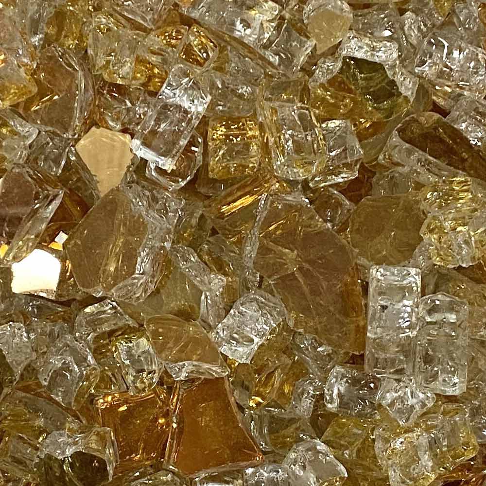 Close-up of gold, amber, and clear reflective fire glass shards