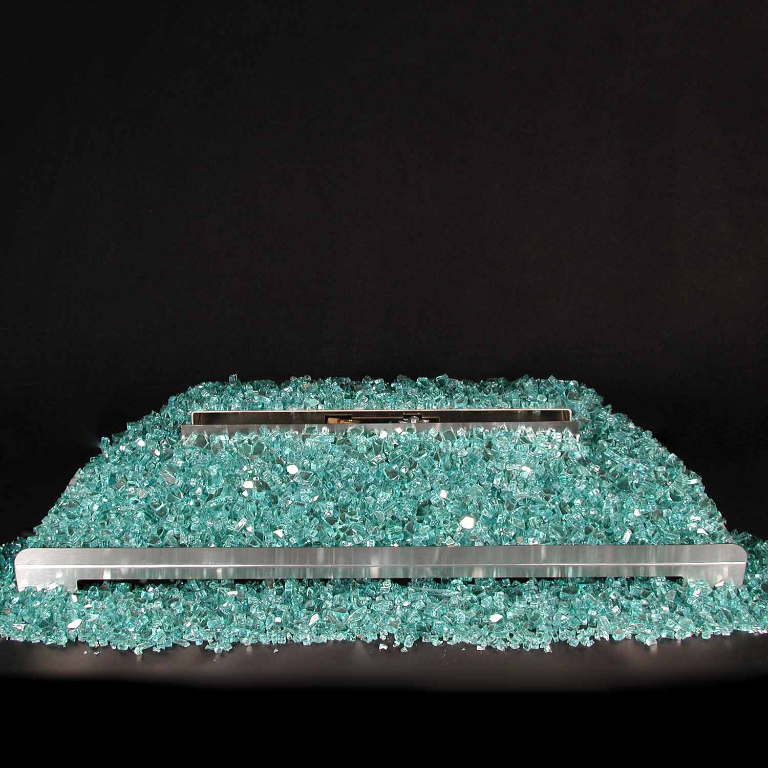 Ventless gas burner with stainless bar over turquoise fire glass, no flames