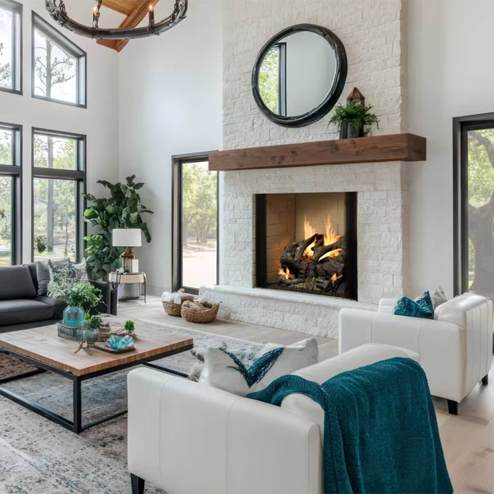 White mantel and stone hearth wood-burning fireplace with burning fire inside