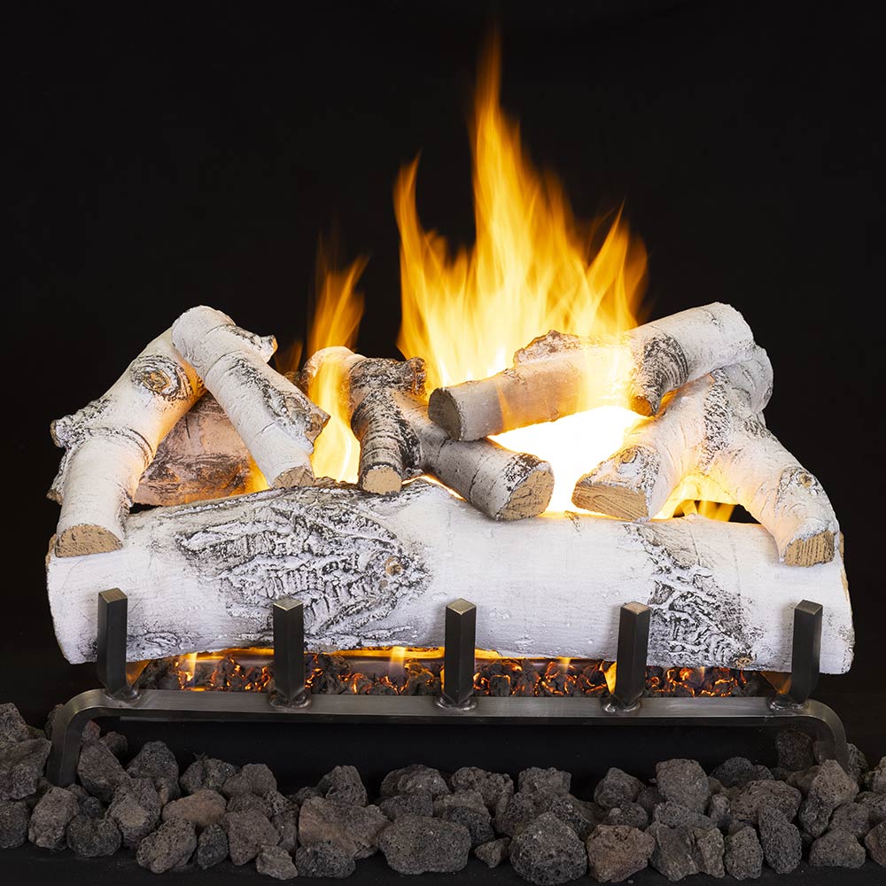 Vented ceramic fiber gas log set with white birch logs and open flames