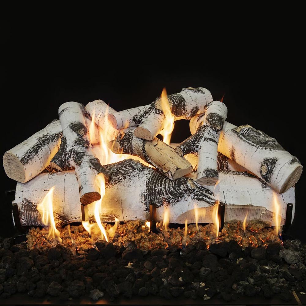 Double-sided vented gas logs with white ash finish, stacked charred wood and flames