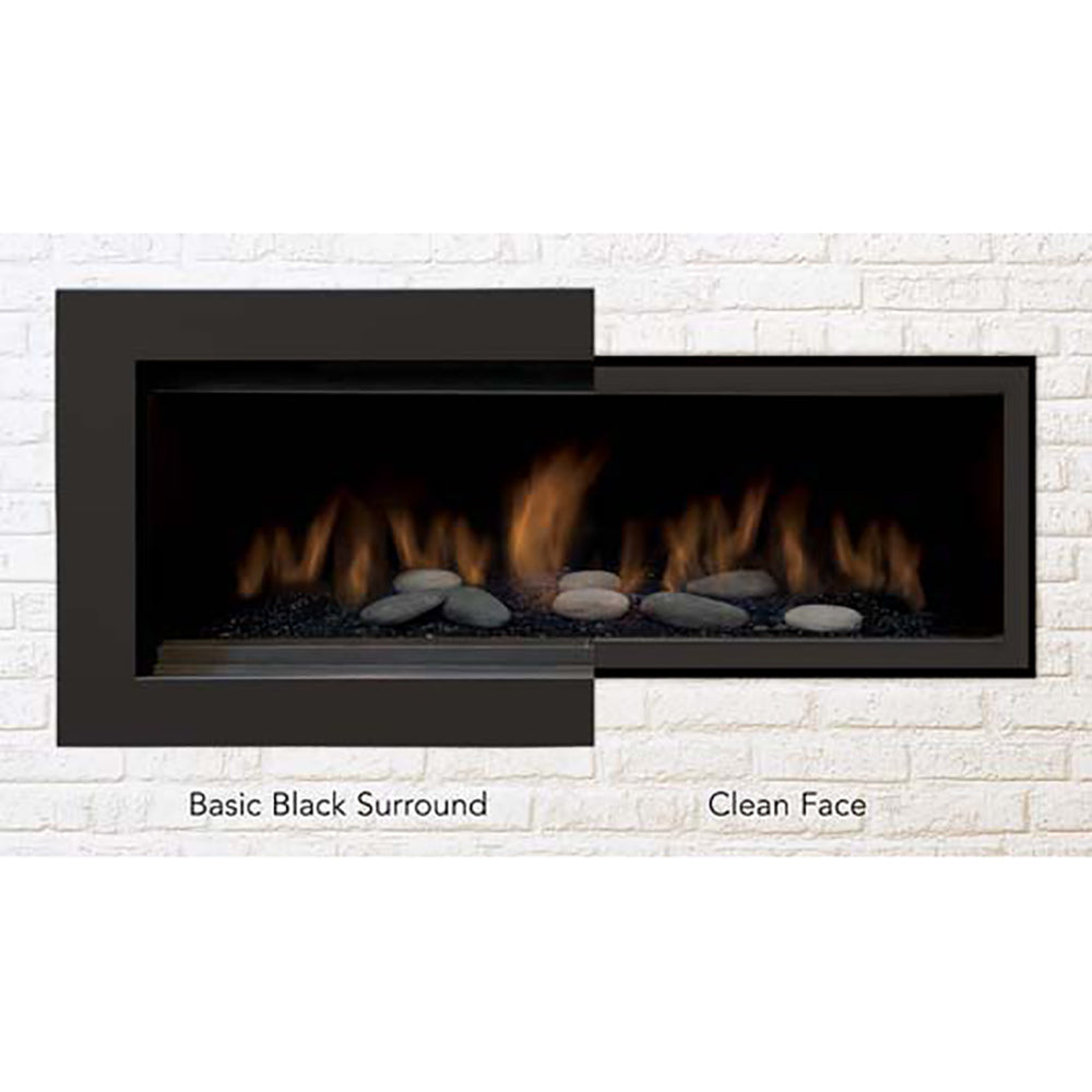 Linear gas fireplace with black surround and visible flames over rock media