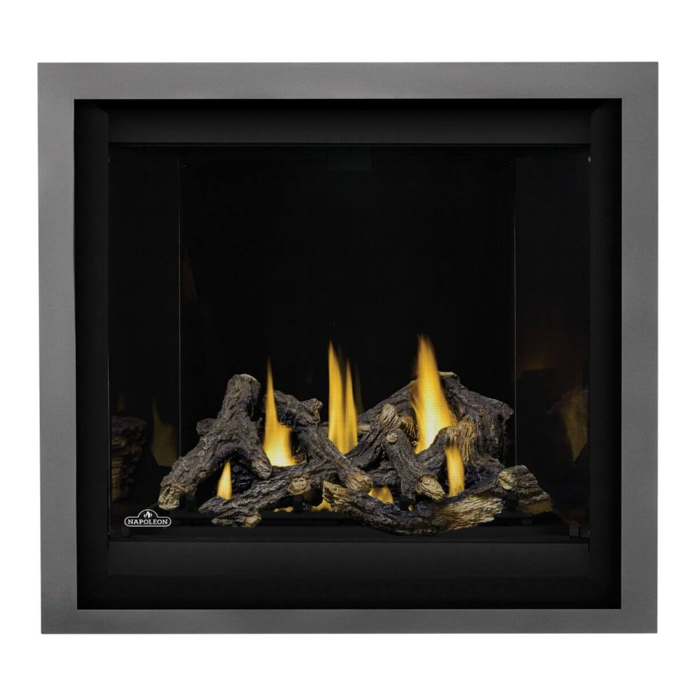 Black direct vent gas fireplace showing burning logs and flames in the firebox
