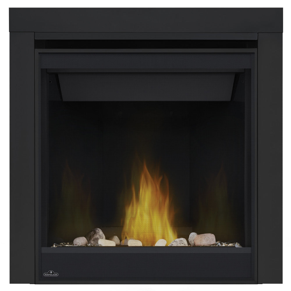 Black direct vent gas fireplace insert with flame over stones and log set
