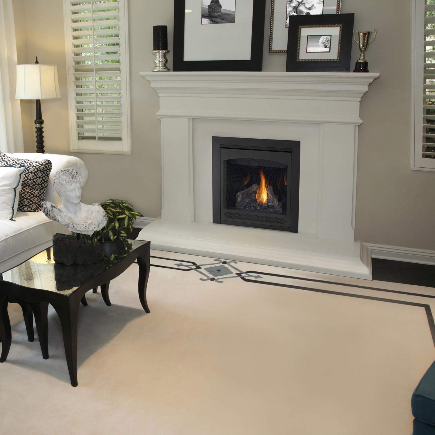 Black gas fireplace insert with flame set into a square front firebox