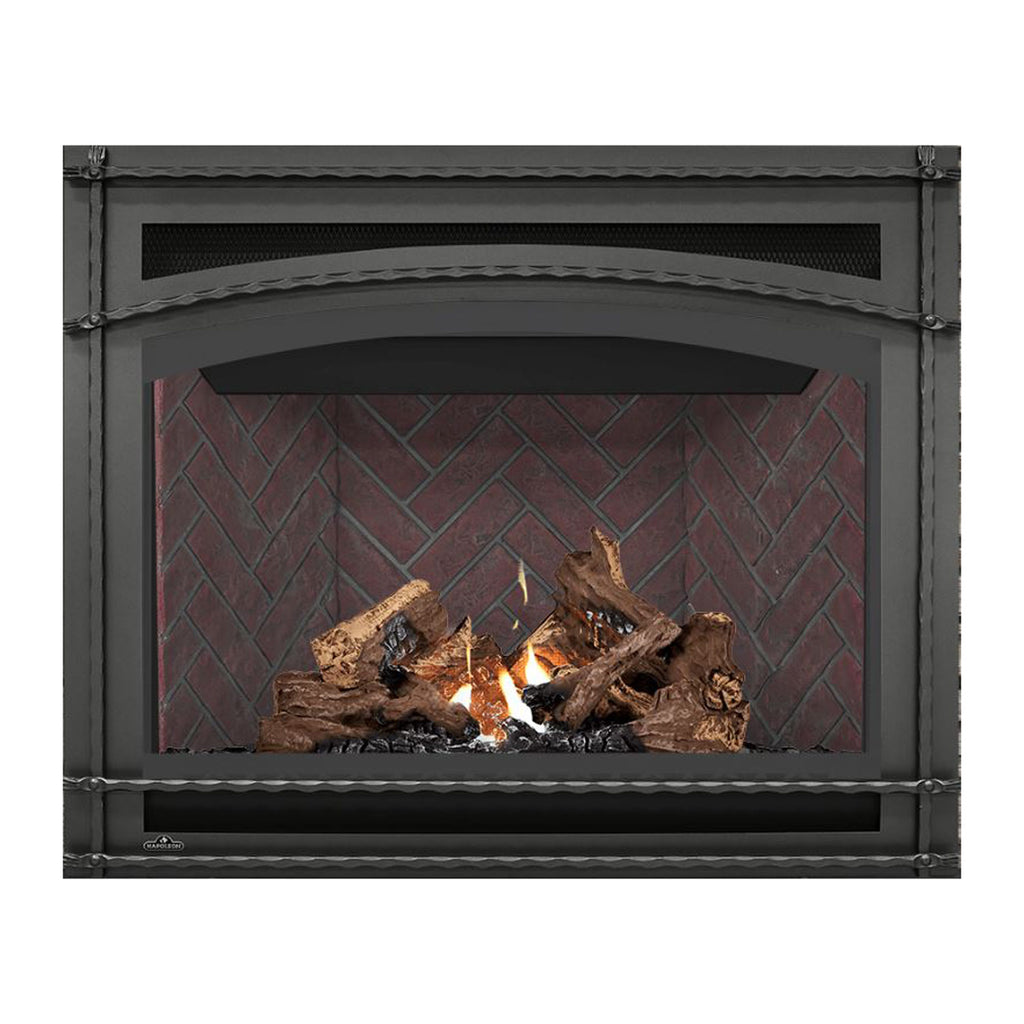 Direct vent gas fireplace with dark surround, visible flame, and log set in front of brick wall