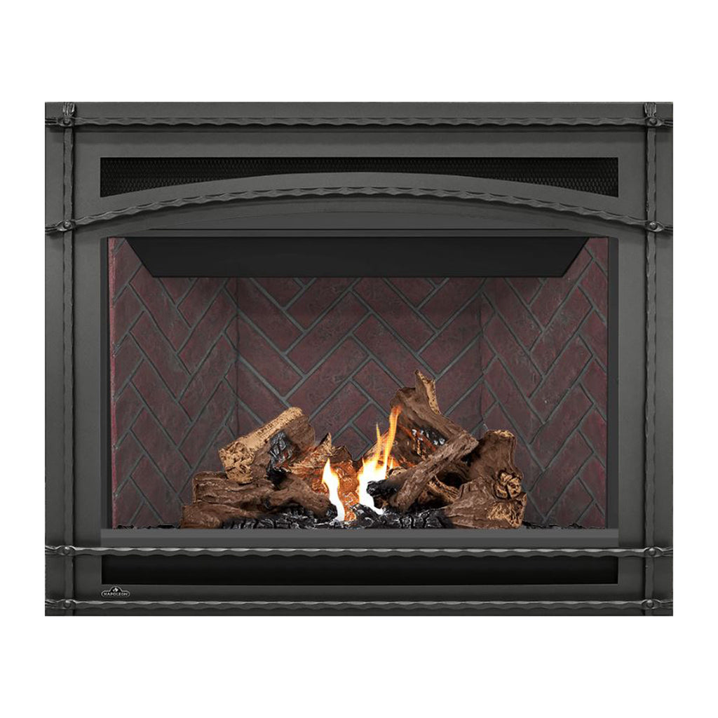 Black direct vent gas fireplace with glass front, flames and stacked logs on brick-pattern back