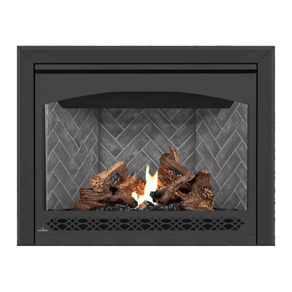 Direct vent gas fireplace with black surround, burning logs, and flames behind gray brick.