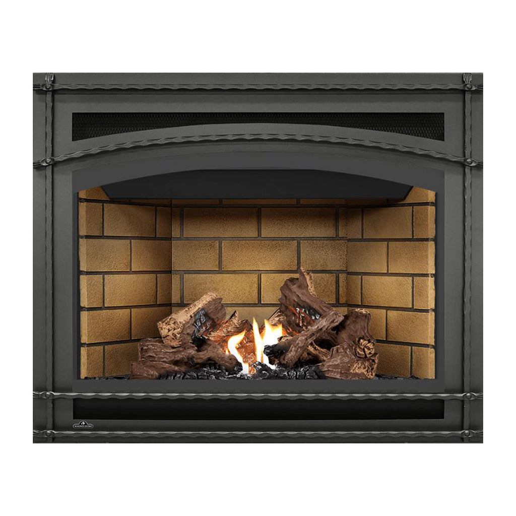 Direct vent gas fireplace with dark front, tan brick interior backing, burning logs