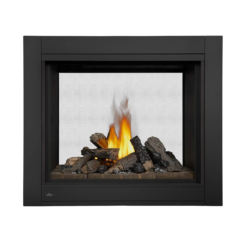 Black direct vent gas fireplace with burning logs and a rocky fire bed