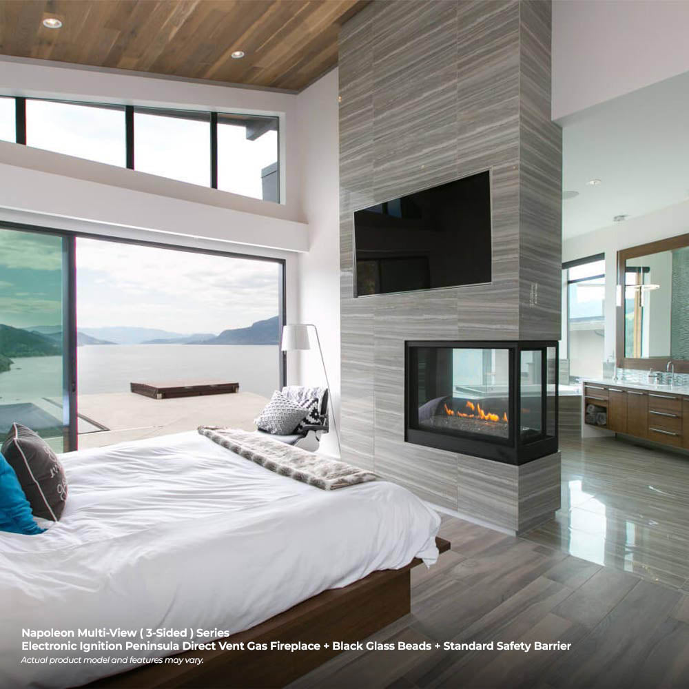 Black multi-view direct vent gas fireplace with glass bed flame, black surround