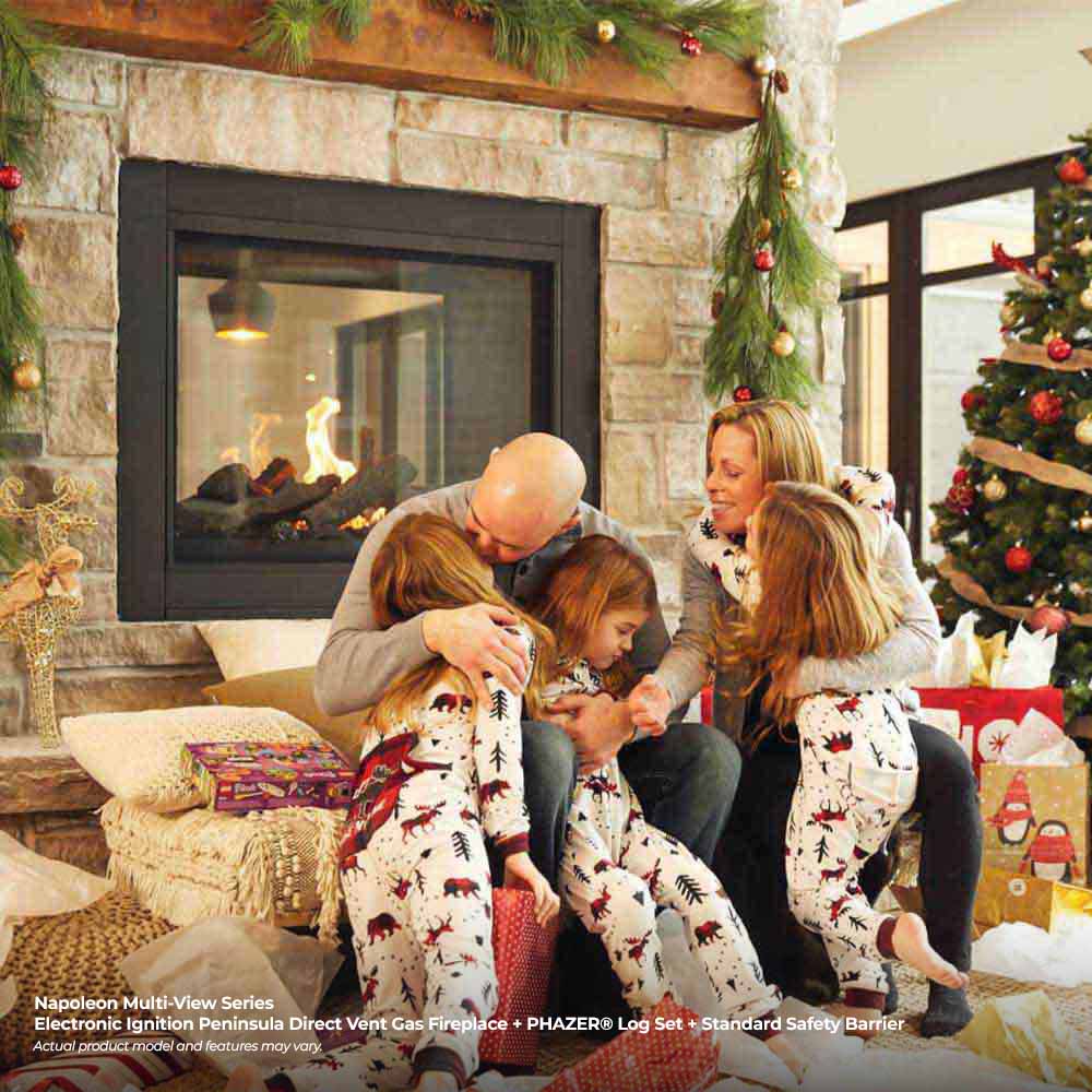 Direct-vent gas fireplace with burning logs in a stone surround during holiday gathering