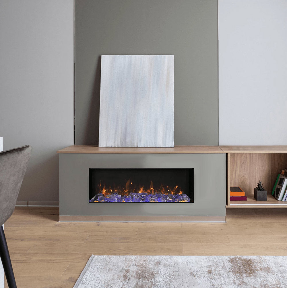 Amantii Panorama Slim built-in electric fireplace installed in a light wood entertainment console