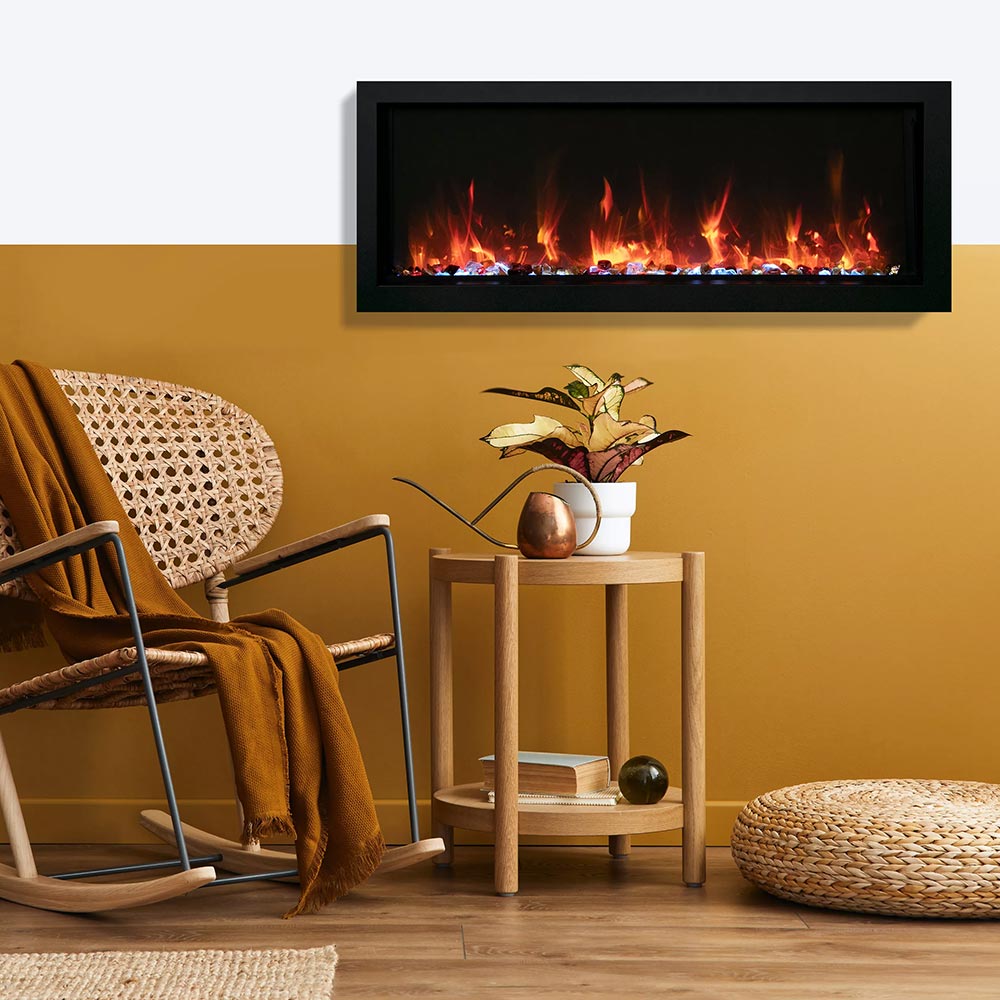 Wall-mounted electric fireplace with black surround and wide flame viewing window