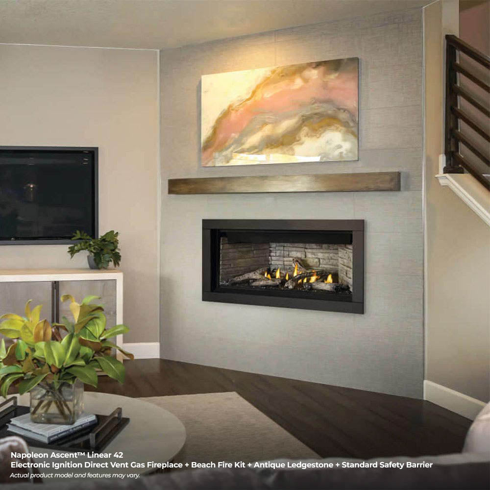 Inset linear gas fireplace with glass front, stone surround, and glowing flames