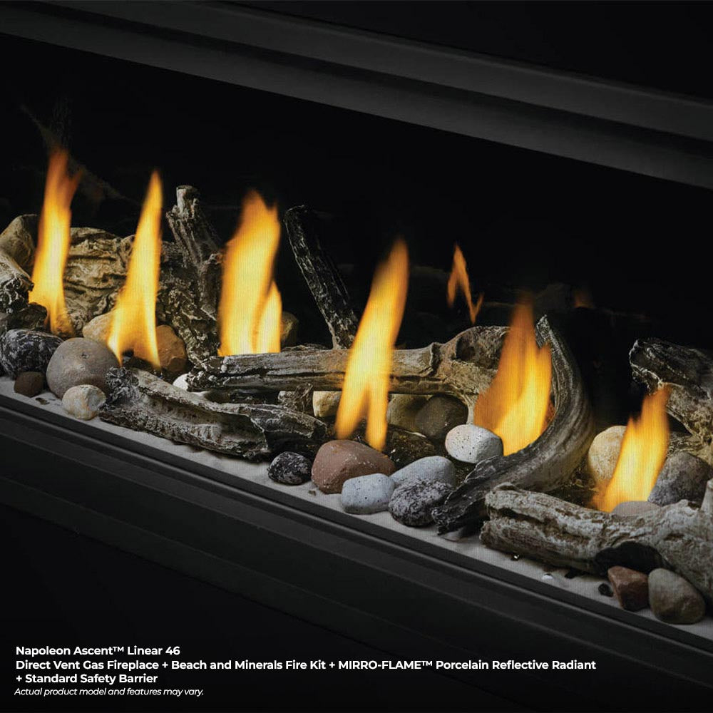 Linear glass-front fireplace with close-up flames and rock and log bed