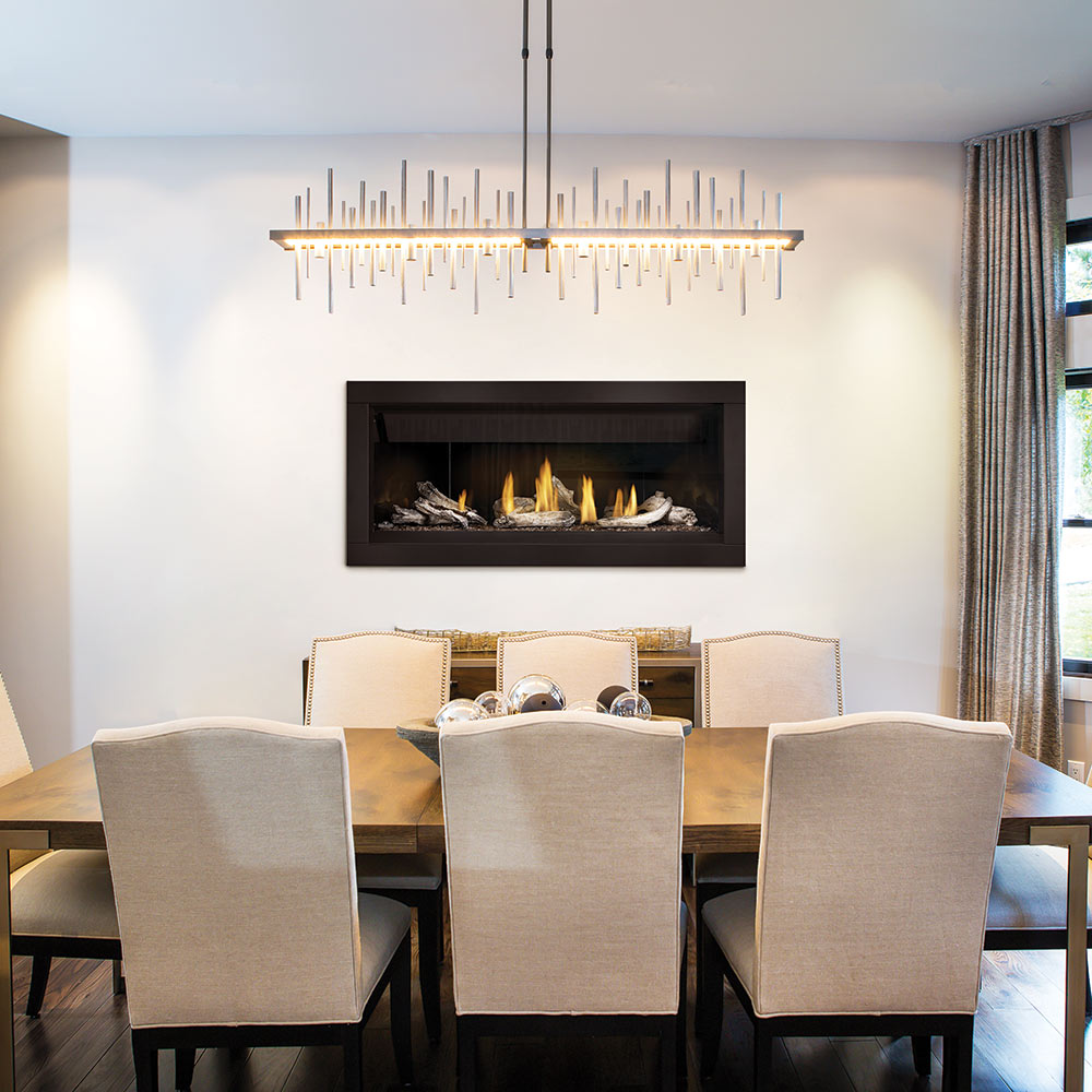 Built-in linear gas fireplace with illuminated burner and decorative logs