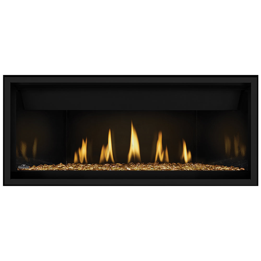 Direct vent gas fireplace with glowing orange flames and amber gold glass embers base