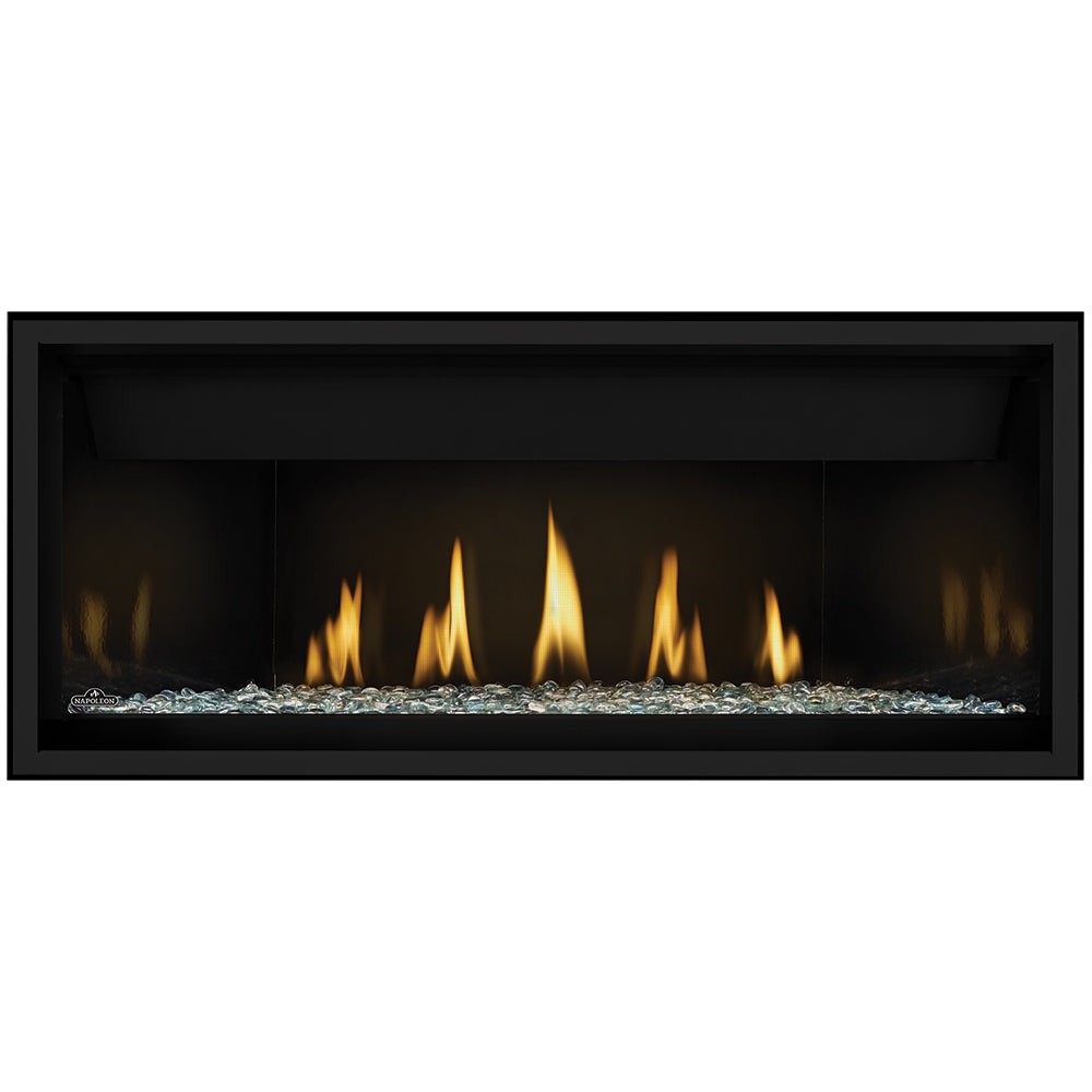 Direct vent gas fireplace with glowing orange flames and clear glass embers base