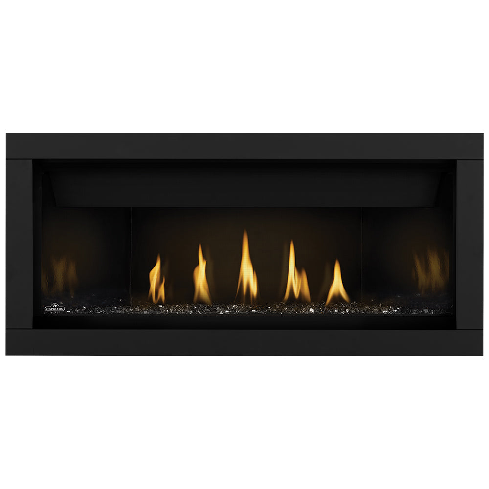 Linear gas fireplace with ember bed and flame row behind glass front