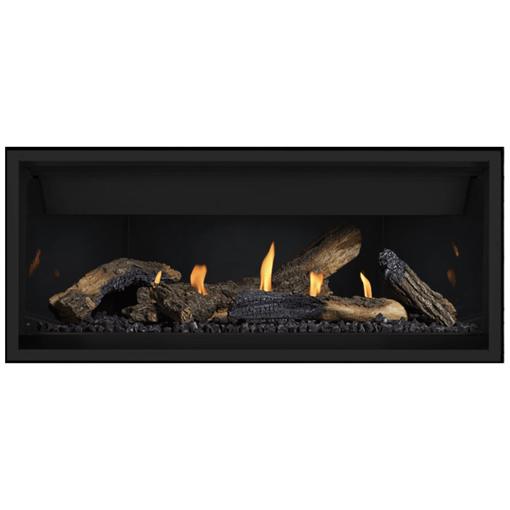 Black linear gas fireplace with charred logs and glowing flames across burner