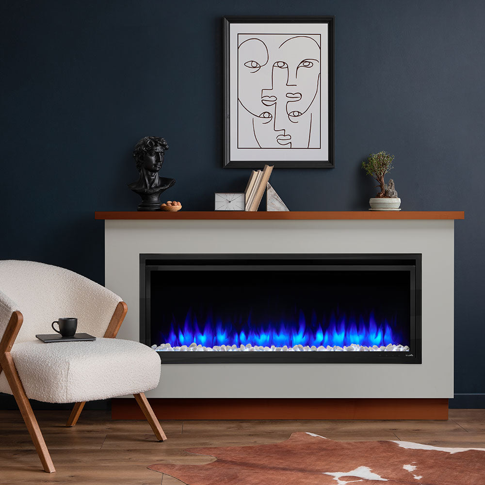 Electric fireplace mantel package with light gray surround and light wood mantel, blue flame