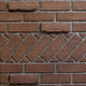 Vent-free firebox liner with tan brick and diagonal accent border texture