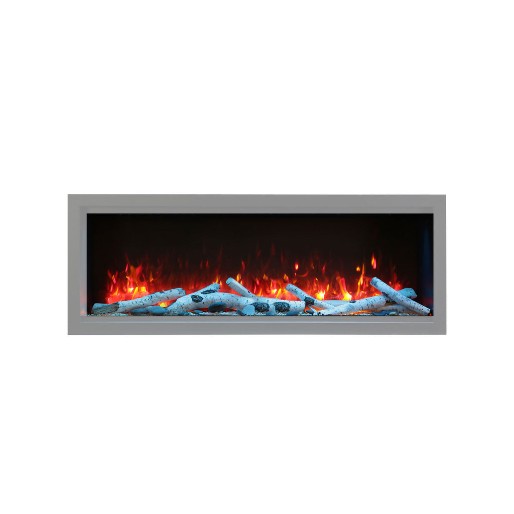 Birch log set in a fireplace with burning flames and gray faux logs