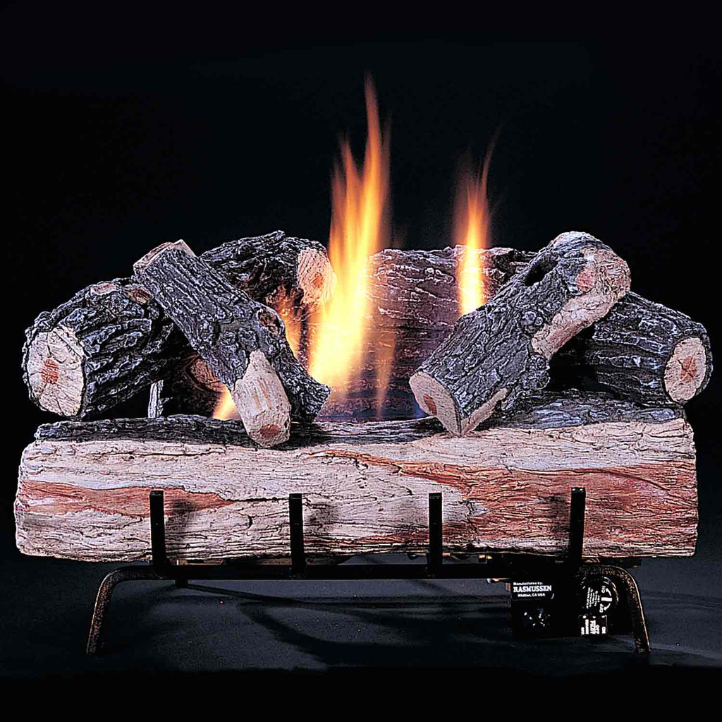 Ventless gas burner with faux logs, glowing coals, and orange flames on black base