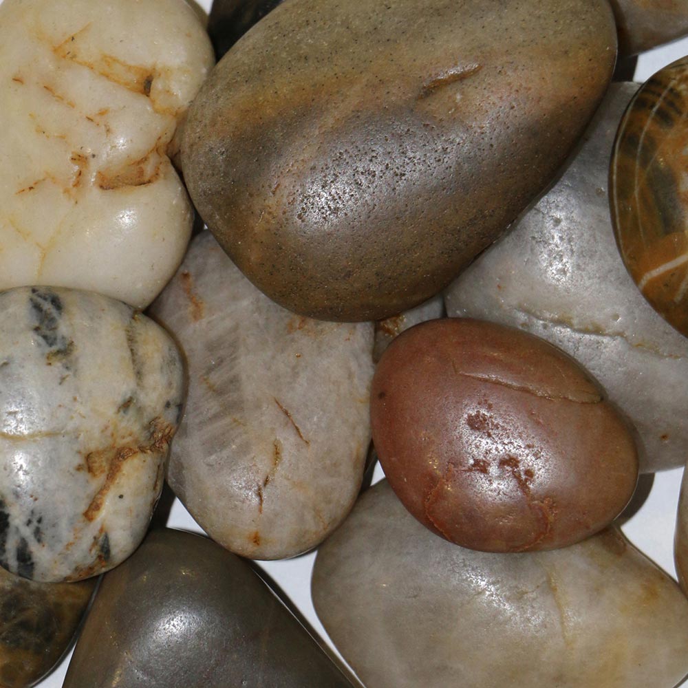 Dimplex river rock media pack of smooth stones in beige, gray, and dark brown