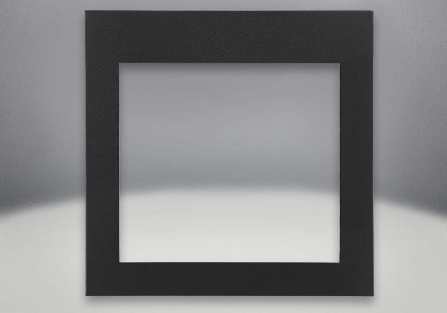 Decorative fireplace front in dark color, flat square frame with inner opening