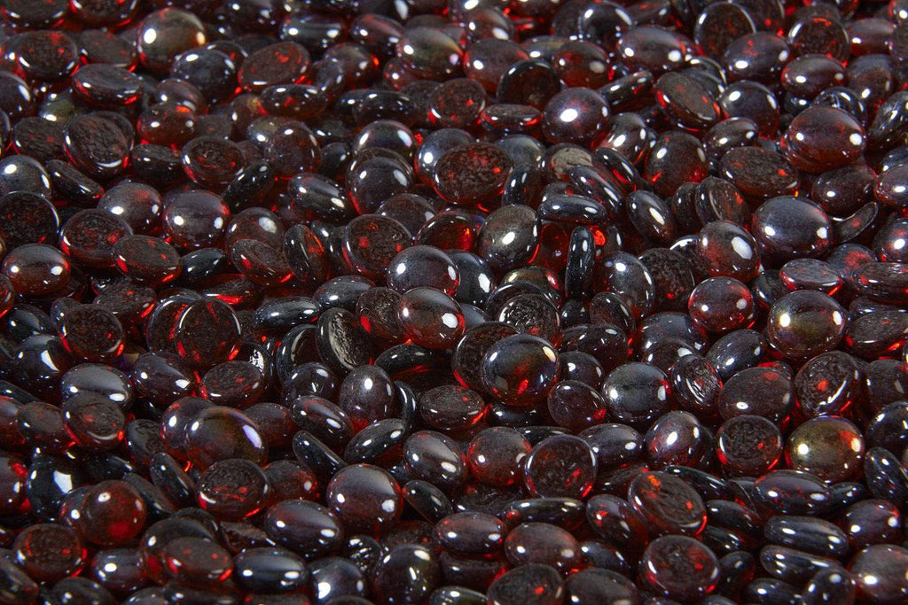 Ruby red crystal fire glass gems, rounded glass beads in a close-up pile