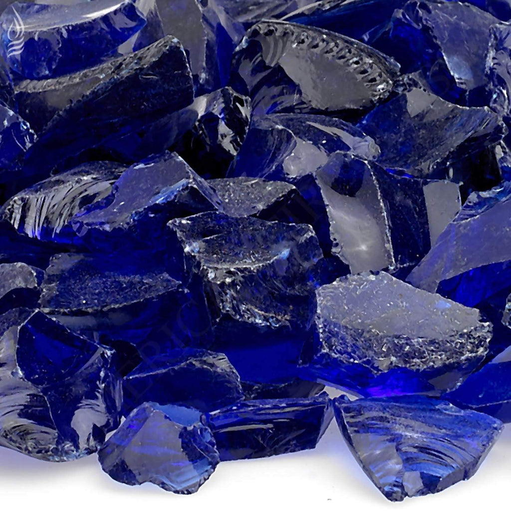 Close-up of dark blue recycled fire glass shards with reflective cut edges