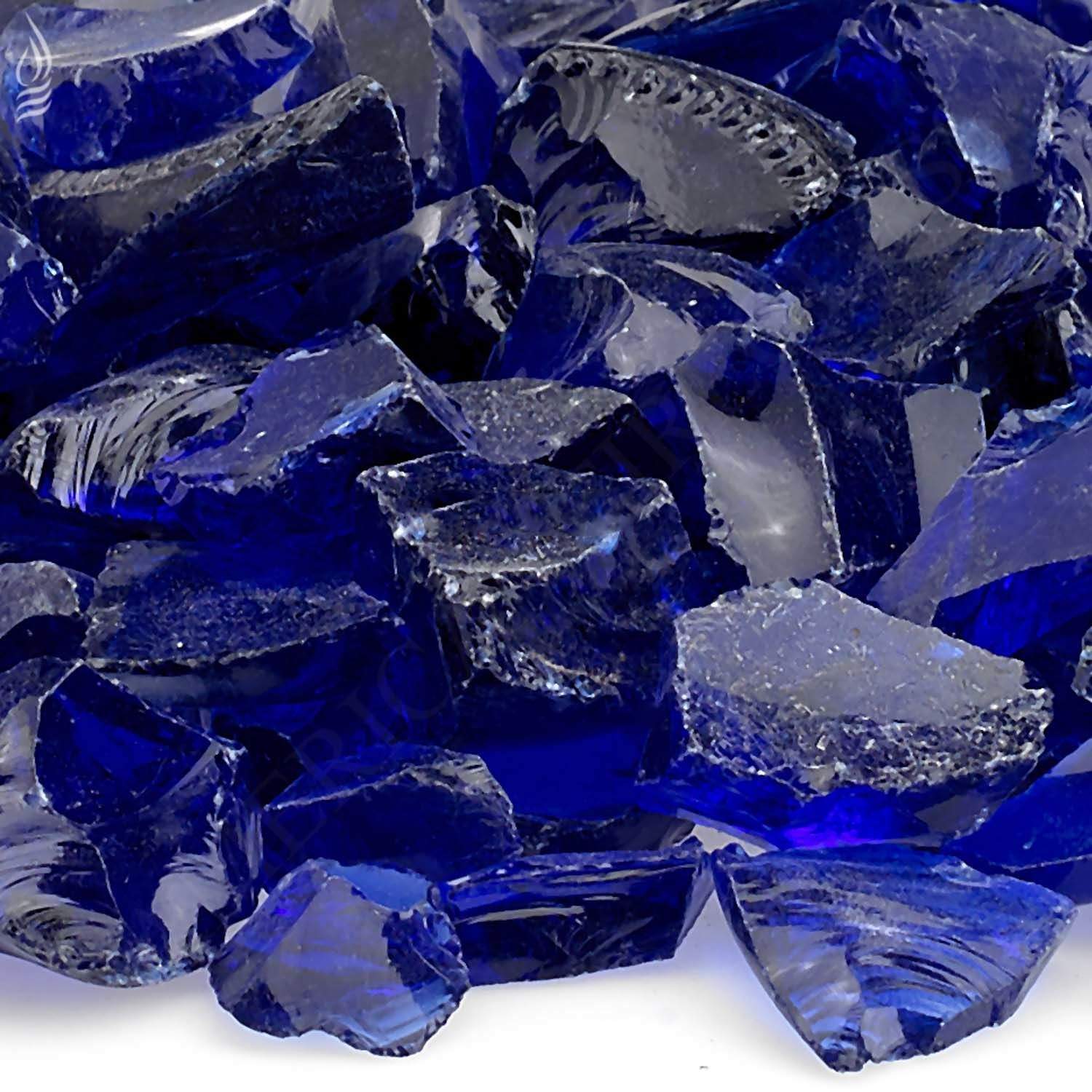 Close-up of dark blue recycled fire glass shards with reflective cut edges
