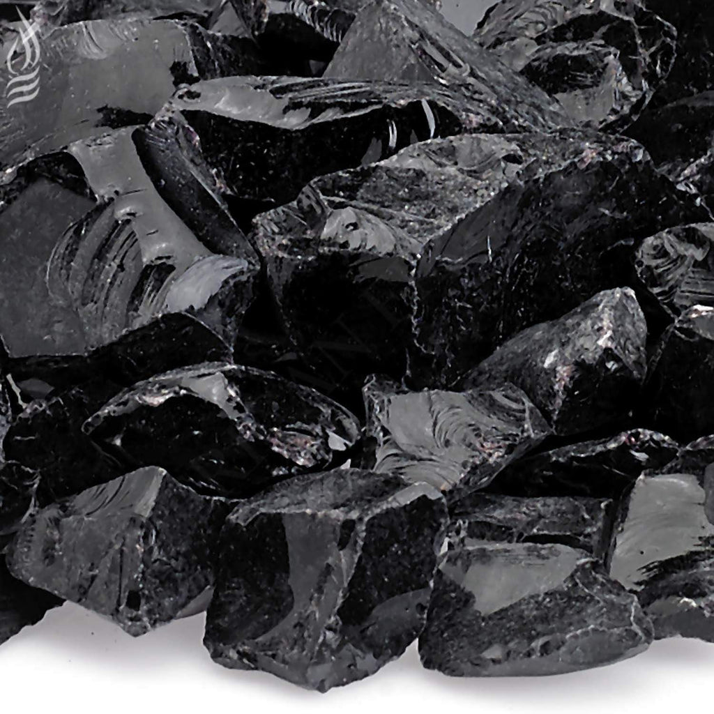 Close-up of onyx recycled fire glass pieces, glossy dark black