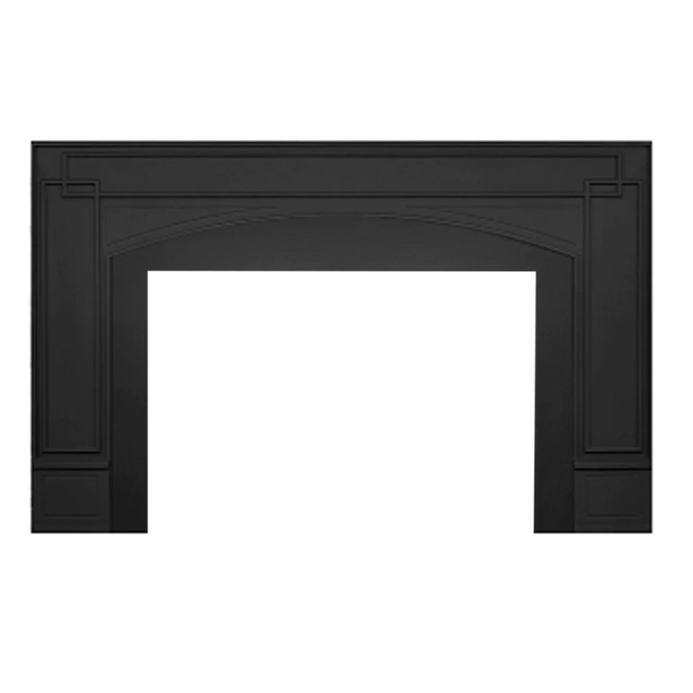 Black cast iron fireplace surround with arched opening and decorative side panels